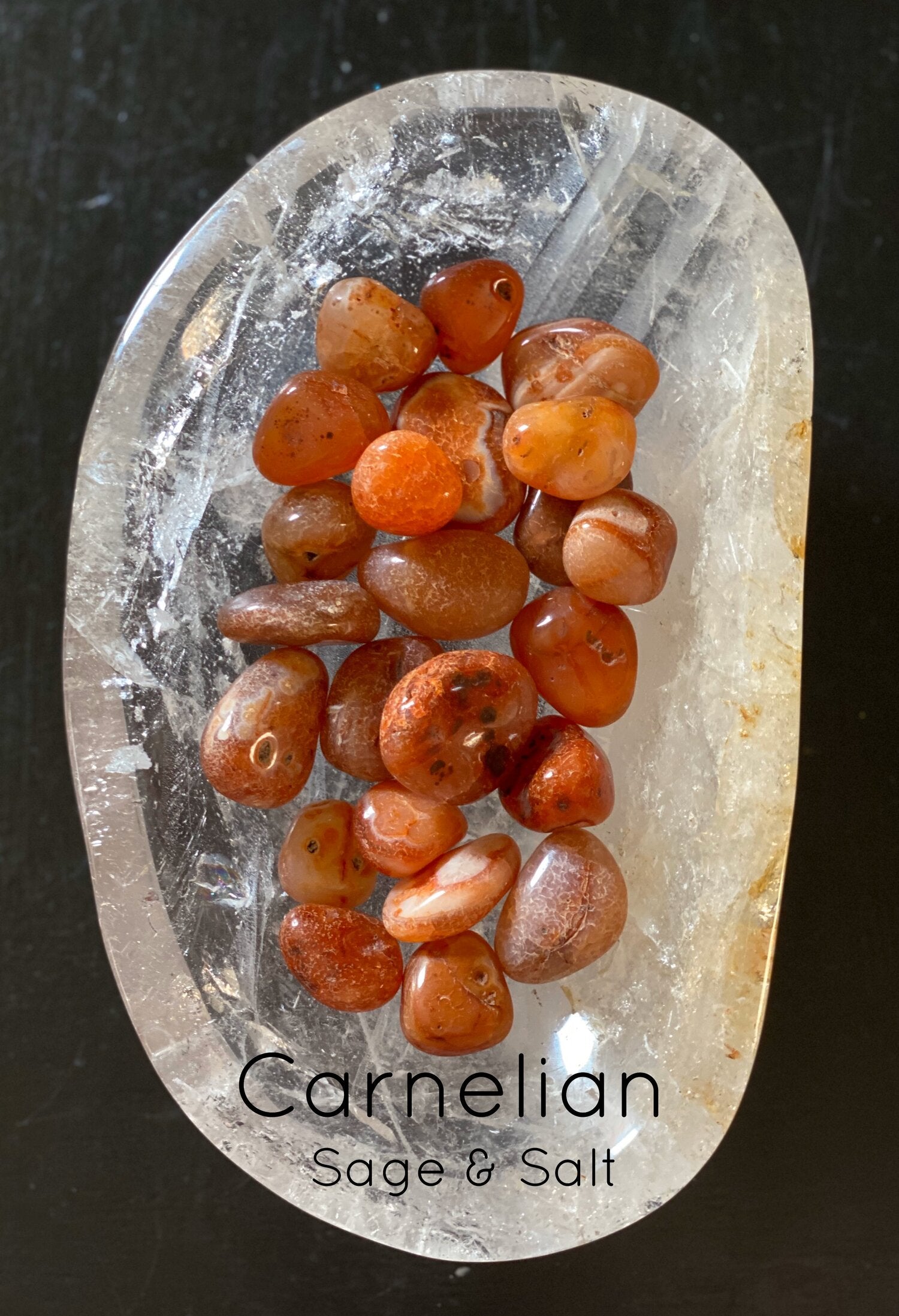 Tumbled carnelian crystal. Sage and Salt